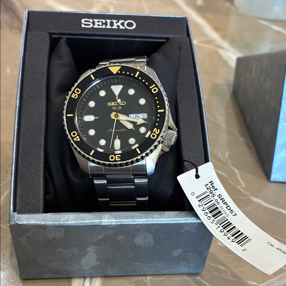 Seiko Black and Silver Watch with Yellow Accents